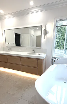double vanity and a glass-enclosed shower